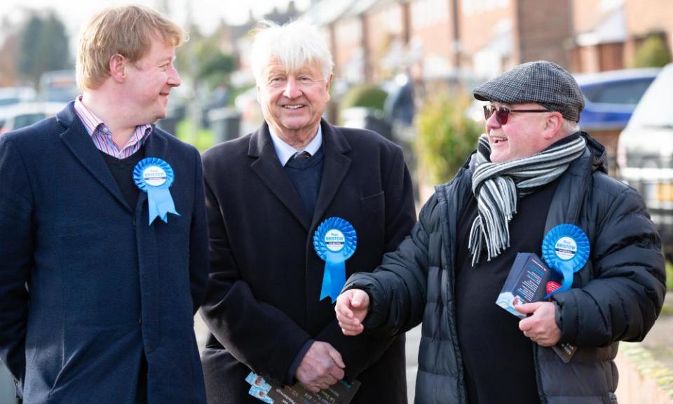 Paul Bristow, left, is joined by Stanley Johnson, centre, during campaigning earlier this month.