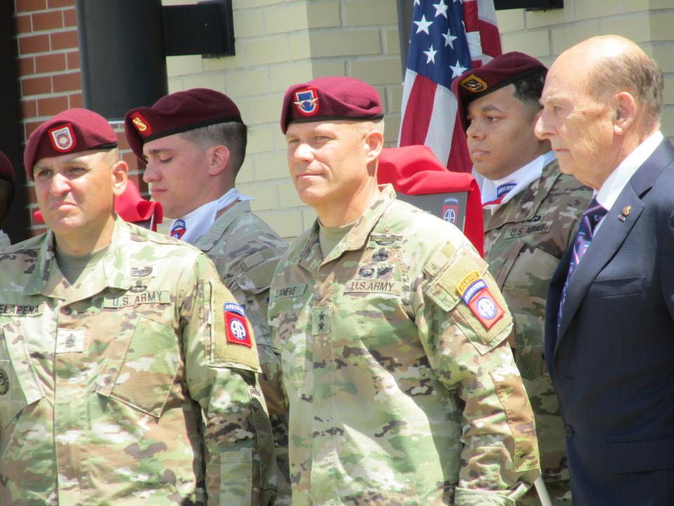 Retired Col. Jack Hamilton, far right, is congratulated by Maj. Gen. Christopher LaNeve, second from right, and Command Sgt. Maj. Randolph Delapena, after being inducted into the 82nd Airborne Division Hall of Fame during a ceremony Wednesday, May 24, 2023, at Fort Bragg.