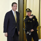 FILE - In this Feb. 2, 2016, file photo, former Montgomery County District Attorney Bruce Castor is directed to another elevator after taking the witness stand in a pretrial hearing for comedian Bill Cosby and his sexual assault case, as he leaves Montgomery County Courtroom A in Norristown, Pa. Cosby was convicted of sexual assault in 2018. He is serving up to 10 years in prison. Now in the midst of another historic reckoning, this time addressing the treatment of African Americans and other people of color by police and the criminal justice system, the 82-year-old Cosby has won the right to an appeal. (Clem Murray/The Philadelphia Inquirer via AP, Pool, File)