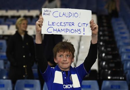 Britain Football Soccer - Chelsea v Tottenham Hotspur - Barclays Premier League - Stamford Bridge - 2/5/16 A Chelsea fan displays a banner in reference to Leicester City manager Claudio Ranieri Reuters / Dylan Martinez Livepic