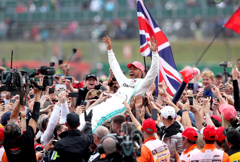 Mercedes' Lewis Hamilton celebrates winning the British Grand Prix at Silverstone, Towcester.