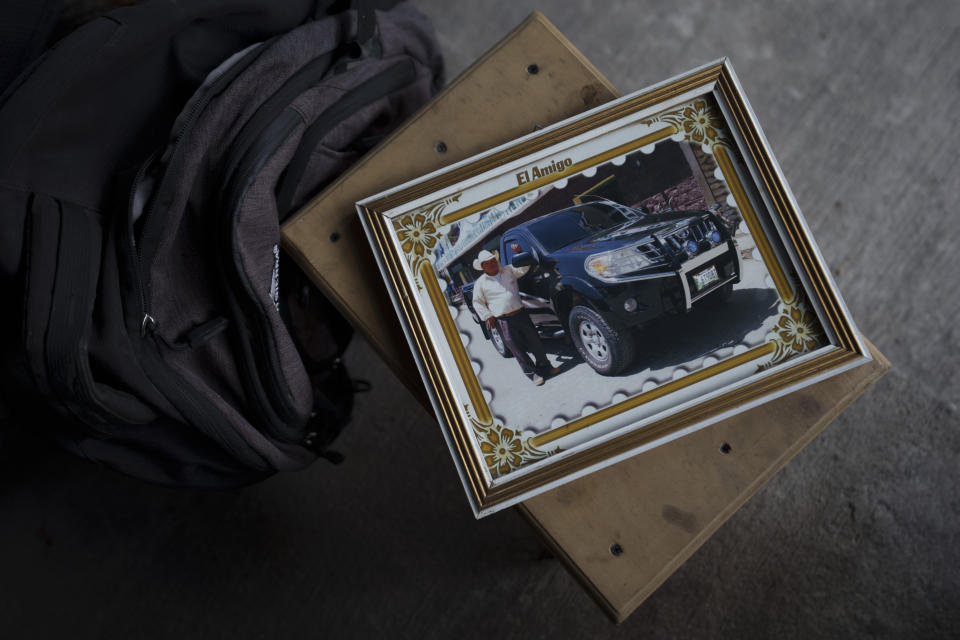 A framed photo of Guatemalan migrant Bacilio Sutuj Saravia, who died in a fire at a Mexican migrant detention center, sits on a bench in the family home in San Martin Jilotepeque, Guatemala, Wednesday, March 29, 2023. According to Mexican President Andres Manuel Lopez Obrador, migrants fearing deportation set mattresses ablaze late Monday at the center, starting a fire that left more than three dozen dead. (AP Photo/Moises Castillo)