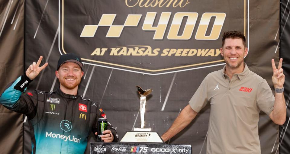 Tyler Reddick, left, and Denny Hamlin celebrate Reddick\