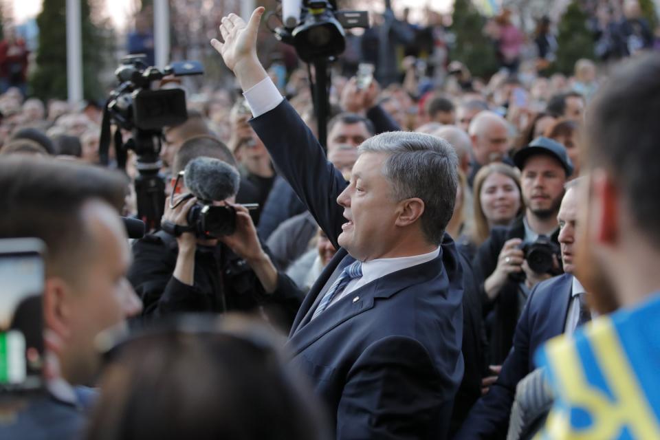 Ukrainian President Petro Poroshenko greets his supporters who have come to thank him for what he did as a president, in Kiev, Ukraine, Monday, April 22, 2019. Political mandates don't get much more powerful than the one Ukrainian voters gave comedian Volodymyr Zelenskiy, who as president-elect faces daunting challenges along with an overwhelming directive to produce change. (AP Photo/Vadim Ghirda)