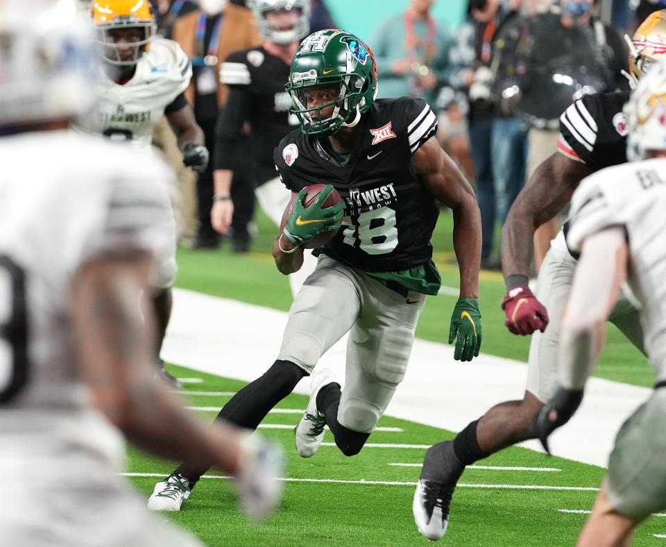 Wide receiver Tyquan Thornton of Baylor, who ran a 4.28-second 40-yard dash at the NFL Combine, looks for an opening during the East-West Shrine Bowl all-star game in February. On Friday night, he was chosen in the second round of the NFL Draft by the Patriots.