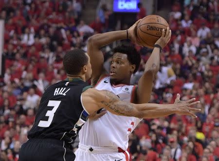 May 25, 2019; Toronto, Ontario, CAN; Toronto Raptors guard Kyle Lowry (7) looks to make a pass as Milwaukee Bucks guard George Hill (3) defends in the first half of game six of the Eastern Conference final at Scotiabank Arena. Dan Hamilton-USA TODAY Sports