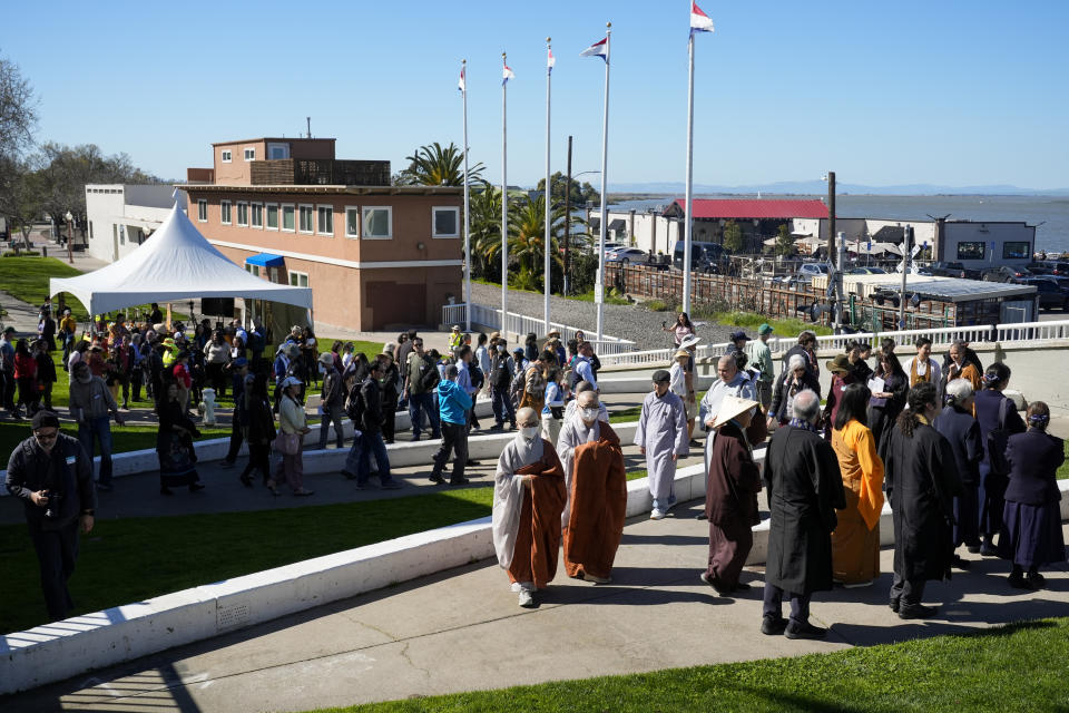 Buddhist faith leaders and community members participate in a "May We Gather" pilgrimage, Saturday, March 16, 2024, in Antioch, Calif. The event aimed to use karmic cleansing through chants, prayer and testimony to heal racial trauma caused by anti-Chinese discrimination in Antioch in the 1870s. (AP Photo/Godofredo A. Vasquez)