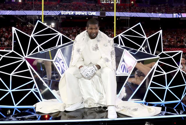 <p>Kevin Mazur/Getty</p> Usher performs onstage during the Apple Music Super Bowl LVIII Halftime Show at Allegiant Stadium on February 11, 2024 in Las Vegas, Nevada.