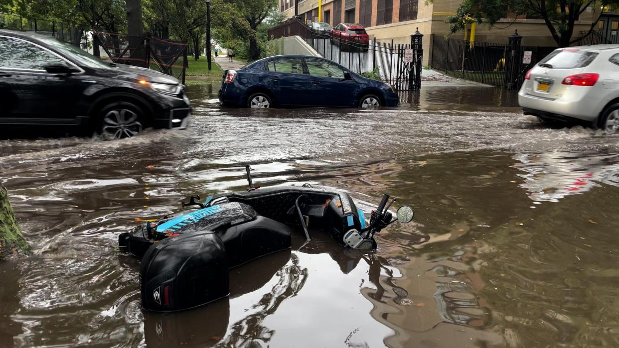 Bike submerged in the rainwater in NYC (The Independent)