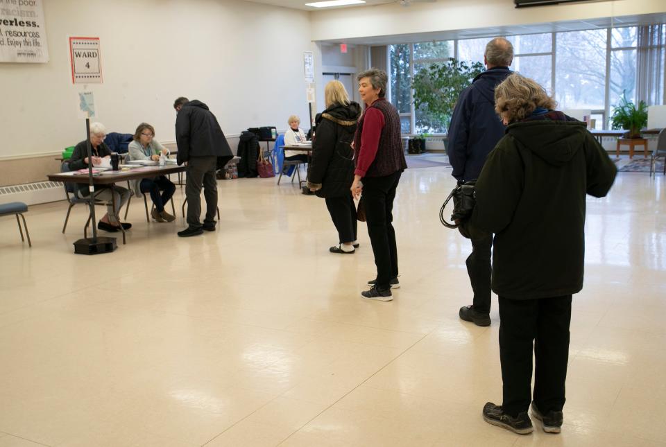 Voters wait in line at the First Congregational Church poll, Tuesday, April 5, 2022, in Sheboygan, Wis.