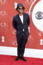 <p>Bobby Wooten III wears a navy suit, matching bucket hat and sunglass on the red carpet. </p>