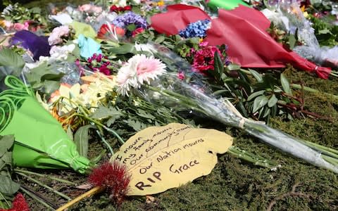 The floral tributes at the Titirangi roundabout grow larger for Grace Millane in Auckland - Credit: Getty