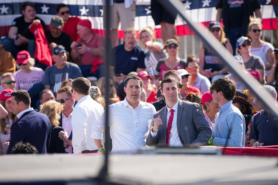 Secretary of State Frank LaRose, middle, attends a rally for former President Donald Trump at the Delaware County Fairgrounds in 2022.