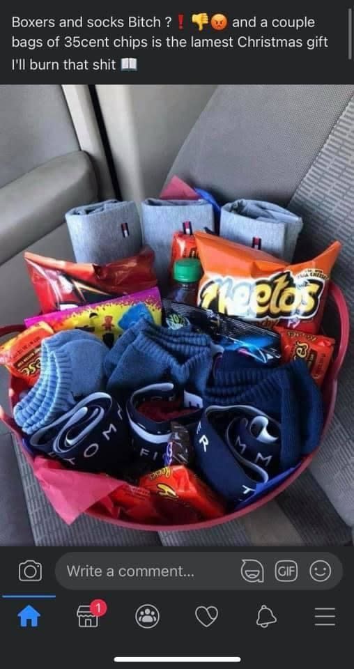 A nicely arranged gift bag with boxers and socks and treats