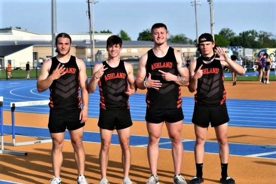Ashland's champion 4x100 relay members Bryant Hosse, Bryce Mendenhall, Kadin Schmitz and Colton Johnson hold up fingers that represent the four digits of the 42.66 they ran for a stadium record during prelims of the Division I district meet.