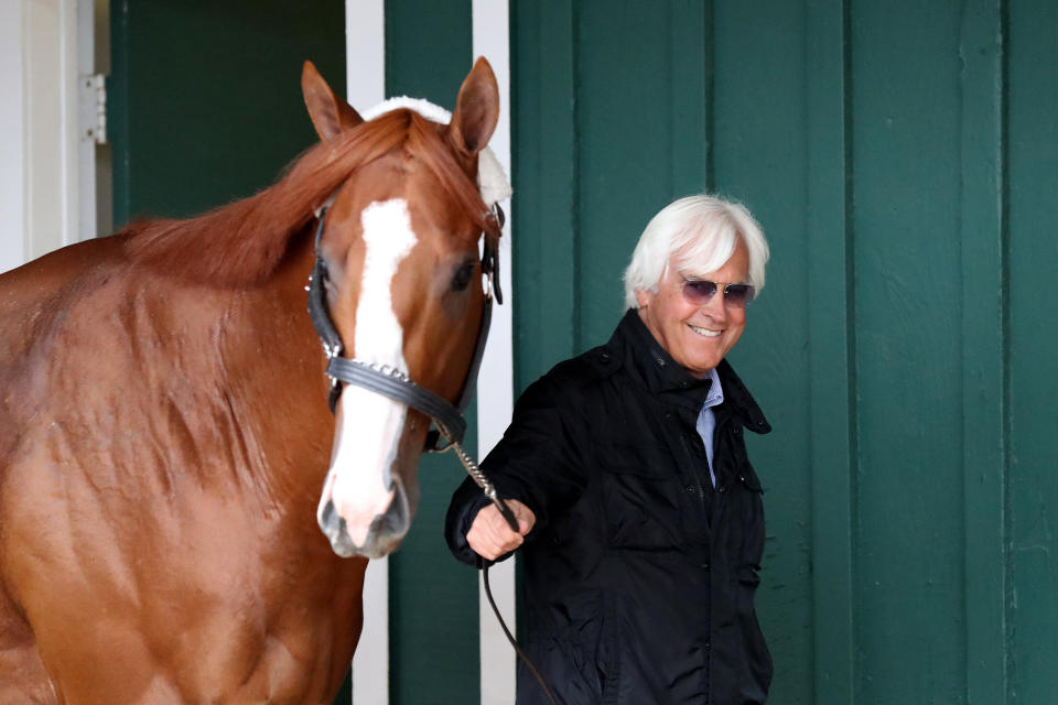 Trainer Bob Baffert walks Kentucky Derby winner Justify in the barn ahead of last year's Preakness Stakes in Baltimore. (Photo: Rob Carr via Getty Images)