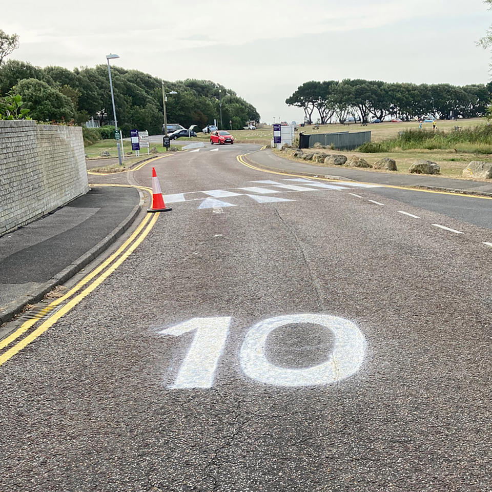 A man in the UK has painted a crossing on his road to help out his disabled wife. Source: Bournemouth News/Australscope