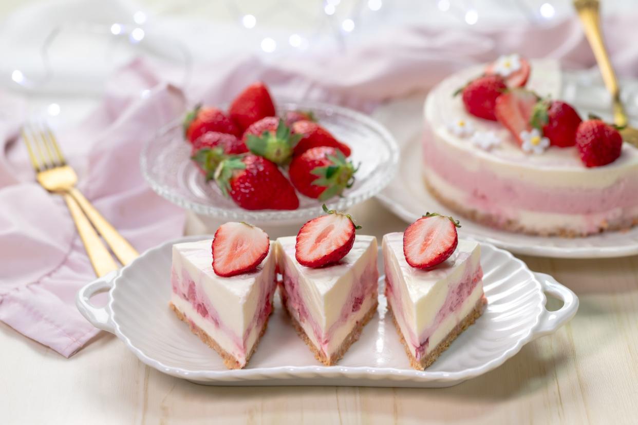 Sliced strawberry no-bake cheesecake. Gelatine dessert with strawberry