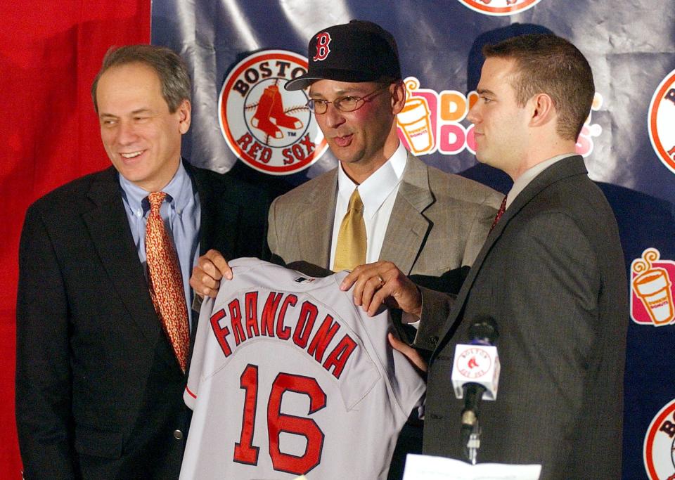 BOSTON, MA - DECEMBER 4:  Larry Lucchino, CEO of the Boston Red Sox (L) and  Red Sox General Manager Theo Epstein (R) stand next to Terry Francona after he was named the Red Sox 44th manager in club history at a Fenway Park December 4, 2003 in Boston, Massachusetts. Francona, who had once managed for the Phillies, will replace Grady Little who was not rehired.  (Photo by Jessica Rinaldi/Getty Images)