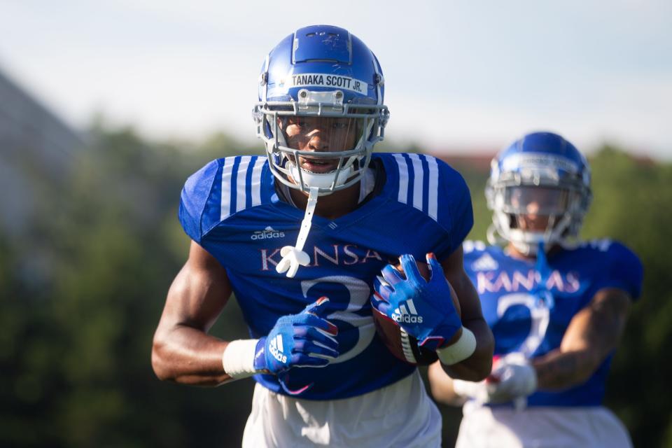 Kansas redshirt freshman wide receiver Tanaka Scott (3) works on resistance drills during practice one morning this month in Lawrence.