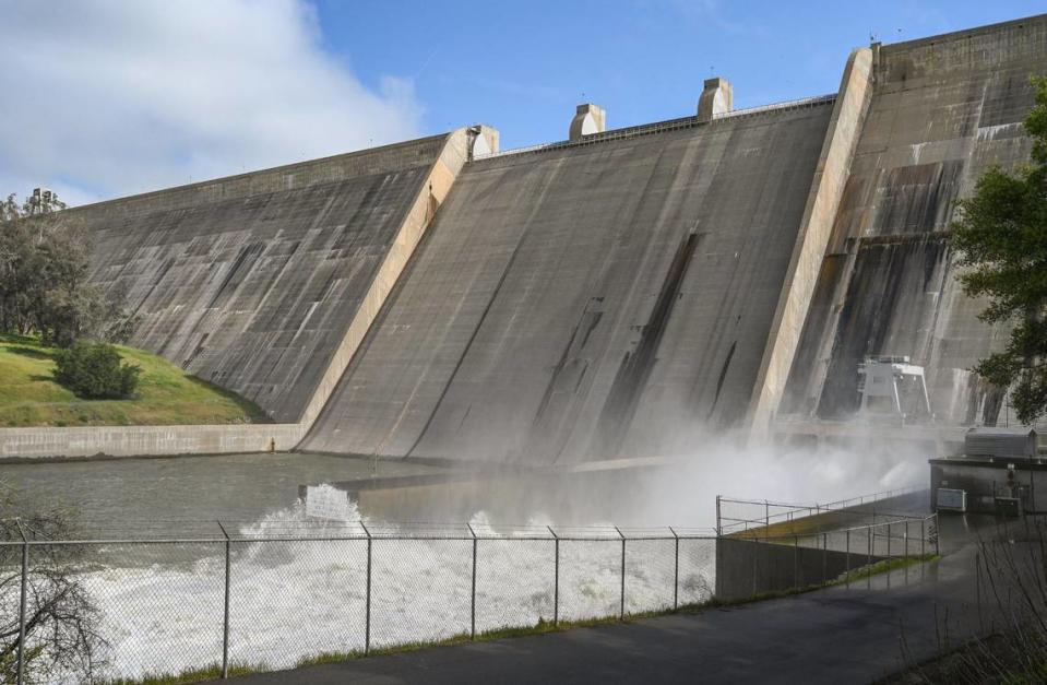 Water is released from the base of Friant Dam at a rate of more than 8,000 cubic feet per second on Tuesday, April 11, 2023 to make room in Millerton Lake for the expected spring and summer melt of the record snowpack in the Sierra Nevada. Officials are expecting the lake will fill to the top causing water to pour over the spillway causing more issues downstream.