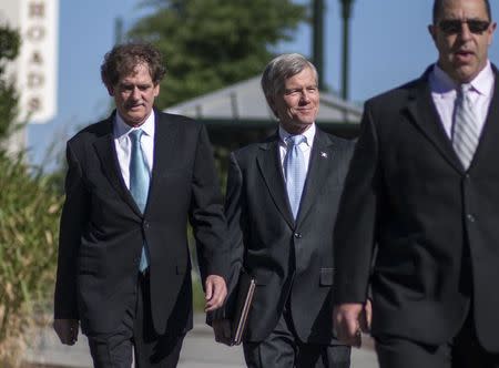 Former Virginia Governor Robert McDonnell arrives with his legal team for his trial in Richmond, Virginia, July 28, 2014. REUTERS/Jay Westcott