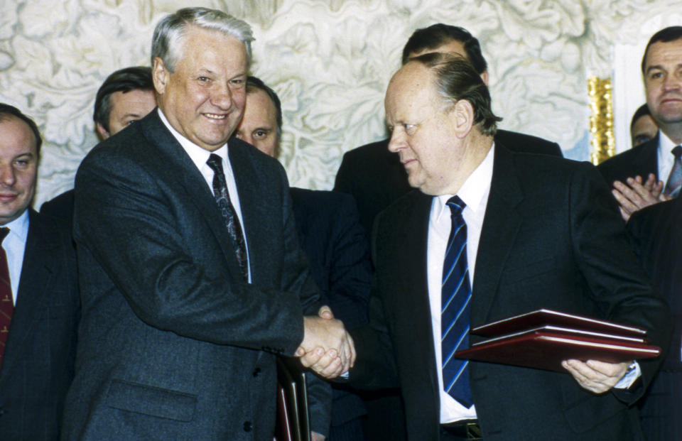 FILE - Russia's President Boris Yeltsin, left, and Belarus' leader Stanislav Shushkevich shake hands in Minsk, Belarus, on Dec. 7, 1991. The leaders of Soviet republics of Russia, Ukraine and Belarus signed an agreement terminating the Soviet Union and declaring the creation of the Commonwealth of Independent States in Viskuli, Belarus, on Dec. 8, 1991. (AP Photo/Alexander Zemlianichenko, File)