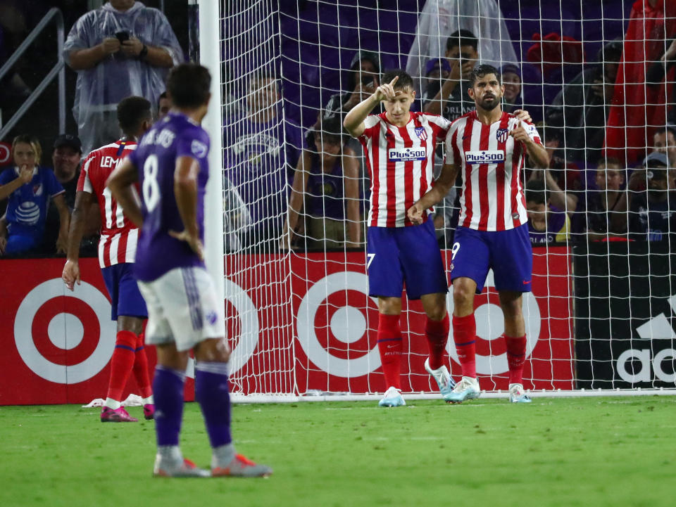 Jul 31, 2019; Orlando, FL, USA; Atletico Madrid forward Diego Costa (19) celebrates with Atletico Madrid forward Ivan Saponjic (17) after scoring a goal against the MLS All Star Team in the second half during the 2019 MLS All Star Game at Exploria Stadium. Mandatory Credit: Kim Klement-USA TODAY Sports