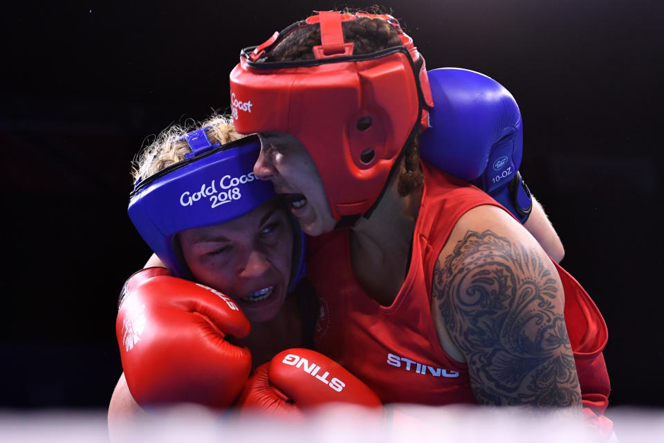 Canada's Tammara Thibeault (R) fights with Wales' Lauren Price during their women's 75kg semi-final boxing match during the 2018 Gold Coast Commonwealth Games at the Oxenford Studios venue on the Gold Coast on April 13, 2018. / AFP PHOTO / Anthony WALLACE        (Photo credit should read ANTHONY WALLACE/AFP via Getty Images)