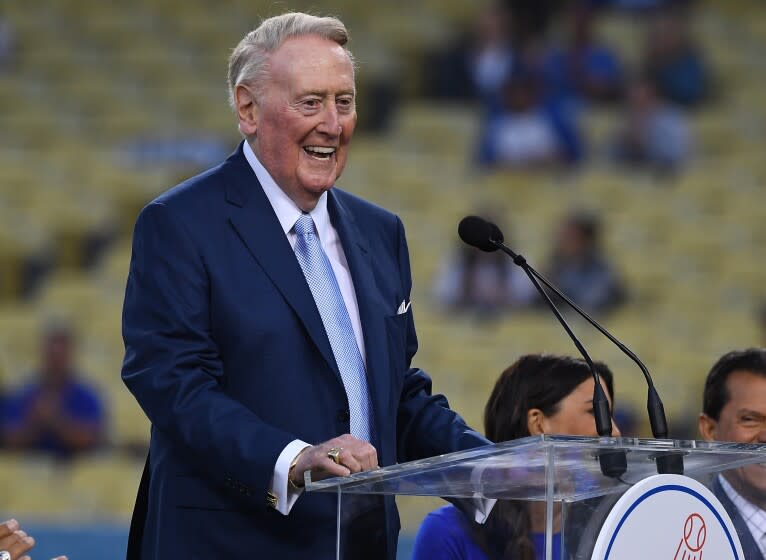 LOS ANGELES, CA - SEPTEMBER 21: Retired Dodgers broadcaster Vin Scully, left speaks during a pregame ceremony honoring language broadcaster Jaime Jarrin inducting him into the Dodger Stadium Ring of Honor at Dodger Stadium on September 2, 2018 in Los Angeles, California. (Photo by Jayne Kamin-Oncea/Getty Images)