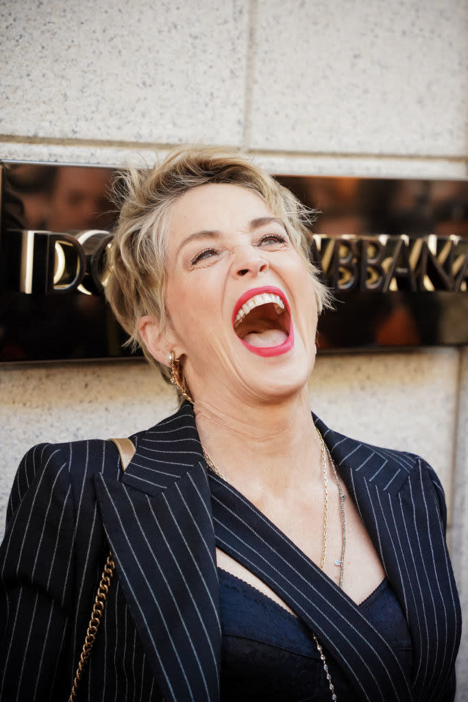 Sharon Stone cackling outside