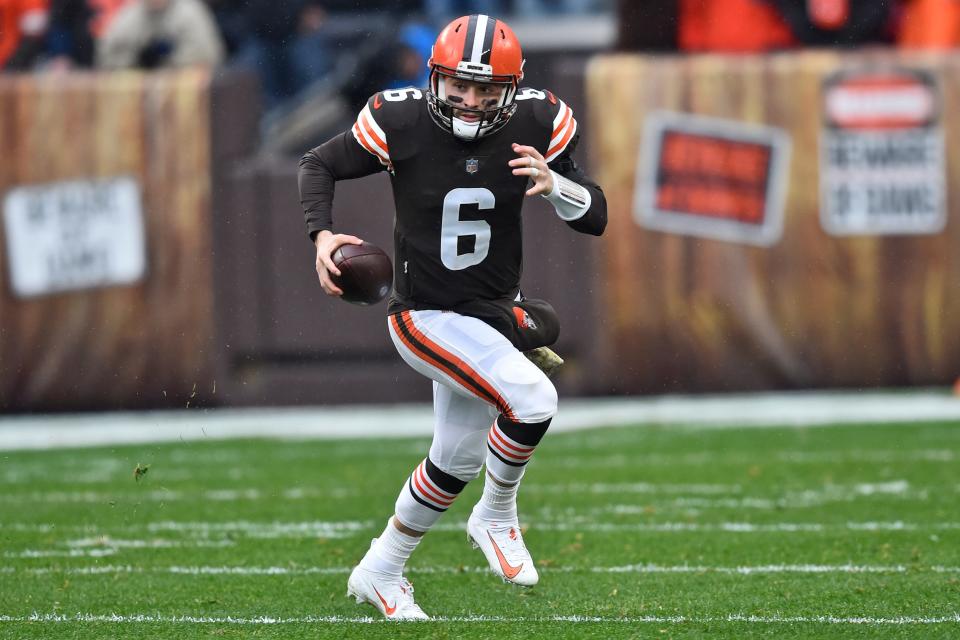 Cleveland Browns quarterback Baker Mayfield scrambles during the first half of an NFL football game against the Detroit Lions, Sunday, Nov. 21, 2021, in Cleveland. (AP Photo/David Richard)