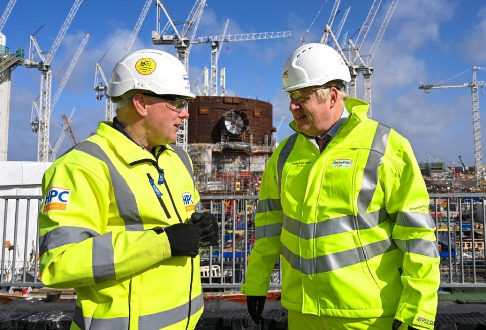 Prime Minister Boris Johnson, with Stuart Crooks, managing director of Hinkley Point C, during a visit to Hinkley Point C nuclear power station construction site in Somerset on April 7, 2022 (Finnbarr Webster/PA) (PA Wire)