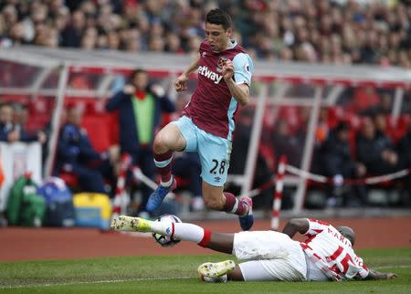 Britain Football Soccer - Stoke City v West Ham United - Premier League - bet365 Stadium - 29/4/17 West Ham United's Jonathan Calleri in action with Stoke City's Bruno Martins Indi Reuters / Andrew Yates Livepic