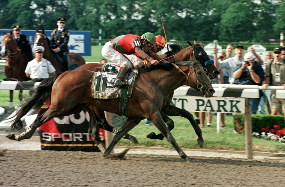 Real Quiet’s bid for a Triple Crown was thwarted at the last moment when Victory Gallop lunged ahead by a nose to win the Belmont Stakes in a photo finish. (Getty)