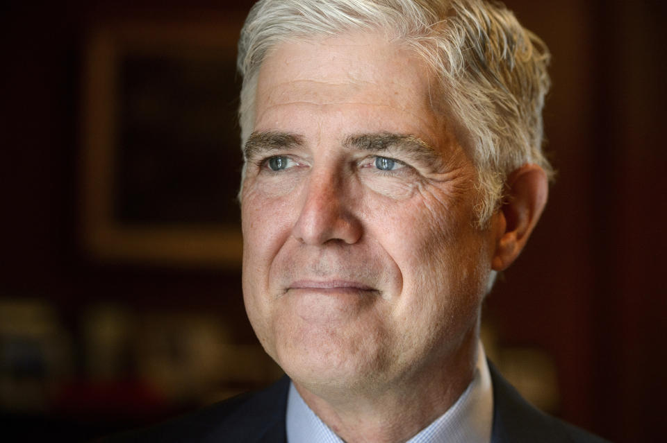 Supreme Court Justice Neil Gorsuch poses for a portrait in his office at the Supreme Court, Monday, July 29, 2024, in Washington. Gorsuch is out with a new book in which he says ordinary Americans are "getting whacked" by too many laws and regulations. "Over Ruled: The Human Toll of Too Much Law" is being published on Tuesday, Aug. 6. (AP Photo/Rod Lamkey, Jr.)