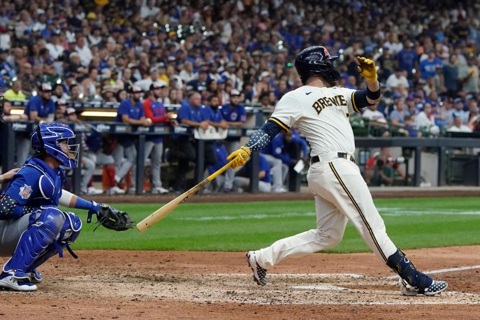 Milwaukee Brewers' Victor Caratini hits a walk off three run home run during the 10th inning of a baseball game against the Chicago Cubs Monday, July 4, 2022, in Milwaukee. (AP Photo/Morry Gash)