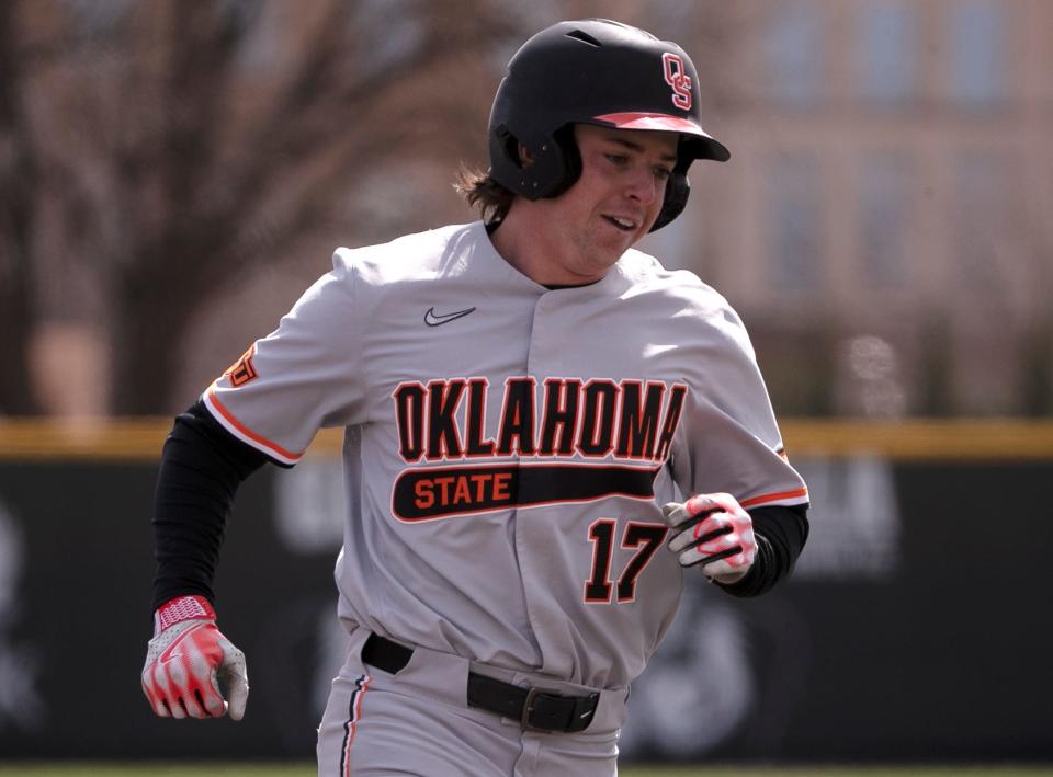 Oklahoma State designated hitter Tyler Wulfert (17) rounds the bases after his second home run of the game Saturday. The 13th-ranked Cowboys beat the 18th-ranked Red Raiders 9-4.