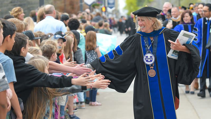 President Noelle Cockett celebrates with elementary school students during an Academic Procession across campus at Utah State University’s commencement ceremony on Thursday, May 4, 2023, in Logan, Utah.