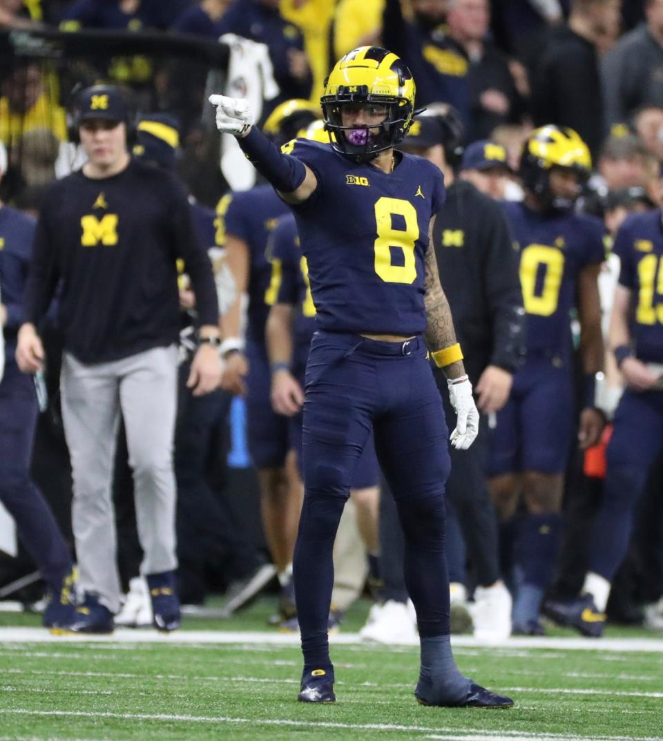 Michigan Wolverines receiver Ronnie Bell picks up a first down against the Purdue Boilermakers during the second half of the Big Ten championship game at Lucas Oil Stadium in Indianapolis, Saturday, Dec. 3, 2022.