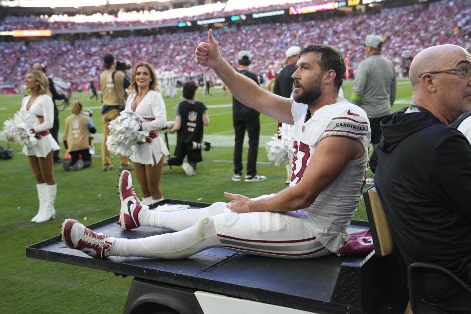 Arizona Cardinals tight end Geoff Swaim (87) gives a thumbs up while being carted off the field after an injury during the second quarter against the San Francisco 49ers at State Farm Stadium in Glendale on Dec. 17, 2023.