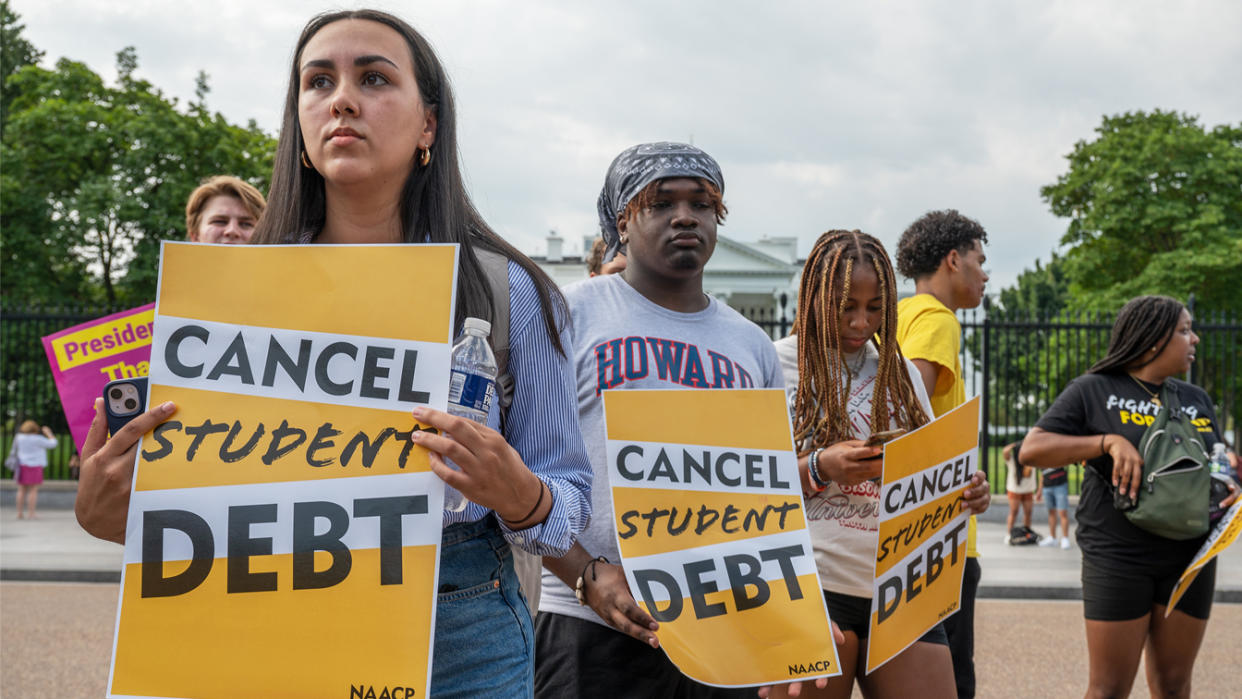 Sabrina Calazans, Aiden Thompson, Sydney Stokes and a handful others hold signs in front of the White House reading: Cancel student debt.