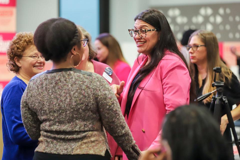 U.S. Representative Rashida Tlaib talks to supporters before a press conference where Gov. Gretchen Whitmer signed the Reproductive Health Act with lawmakers and activists who worked to get the legislation passed at Schoolcraft College in Livonia, Mich. on Tuesday, Nov. 21, 2023.