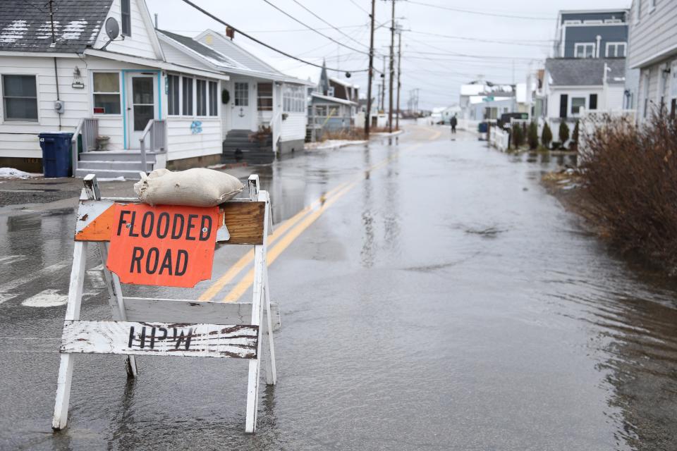 Flooding is seen at high tide at Hampton Beach Monday, Jan. 23, 2023.