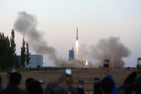 Shenzhou-11 manned spacecraft carrying astronauts Jing Haipeng and Chen Dong blasts off from the launchpad in Jiuquan, China, October 17, 2016. REUTERS/Stringer