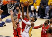 Apr 29, 2016; Indianapolis, IN, USA; Indiana Pacers forward Paul George (13) shoots the ball as Toronto Raptors center Jonas Valanciunas (17) defends during the first quarter in game six of the first round of the 2016 NBA Playoffs at Bankers Life Fieldhouse. Mandatory Credit: Brian Spurlock-USA TODAY Sports
