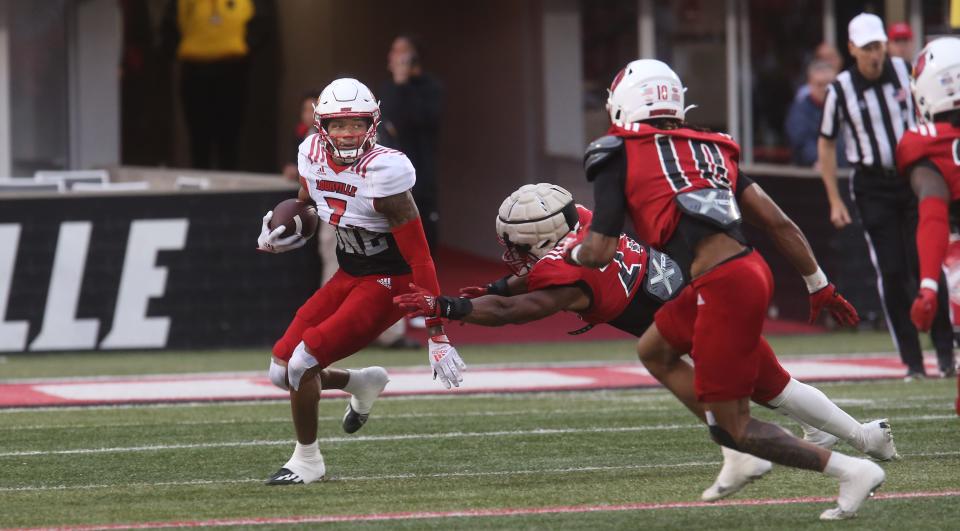 Jimmy Calloway tries to run against defense during Louisville's spring game on April 21, 2023.