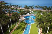 <p>The 25,000+ square foot pool complex at the beachfront on has a theme-park vibe. For instance, there’s a water elevator that rises from a volcano in the water – because how else would you move between nine pools that are on six different levels? A river, which meanders lazily in some places and has whitewater rapids in others, connects the pools, and there are waterslides, waterfalls, caves, and a rope swing. There’s even a baby pool.</p>