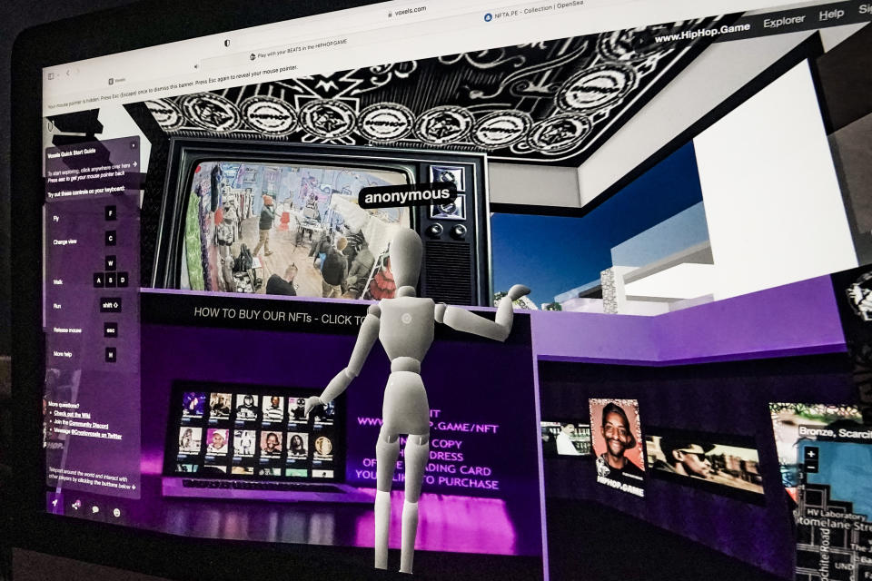 A computer shows the interactive feed from a popup livestream event for "Hiphop.Game," a metaverse platform created by crypto investor Tyrone Norris, also, known as Mental Stamina, to market NFTs and its related cryptocurrency "@Joincoin," Friday Jan. 27, 2023, at Love Gallery in Brooklyn, N.Y. (AP Photo/Bebeto Matthews)