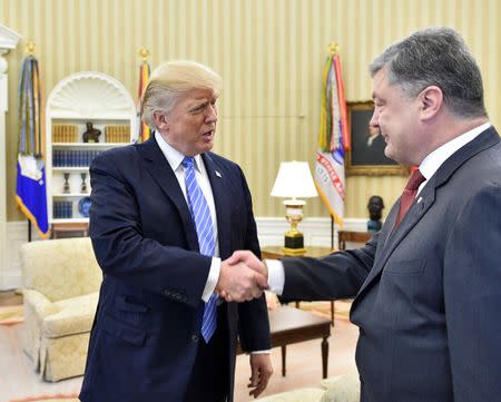 U.S. President Donald Trump shakes hands with Ukraine's President Petro Poroshenko in the Oval Office at the White House in Washington, U.S., June 20, 2017. Mykola Lazarenko/Ukrainian Presidential Press Service/Handout via REUTERS